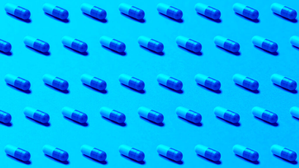 An image of pills in rows to illustrate the amount of intellectual property that pharmaceutical companies have and should protect with continuous pentesting.