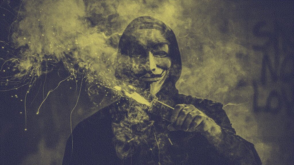 A figure wearing a Guy Fawkes mask holding an incendiary device, tinted yellow and black.