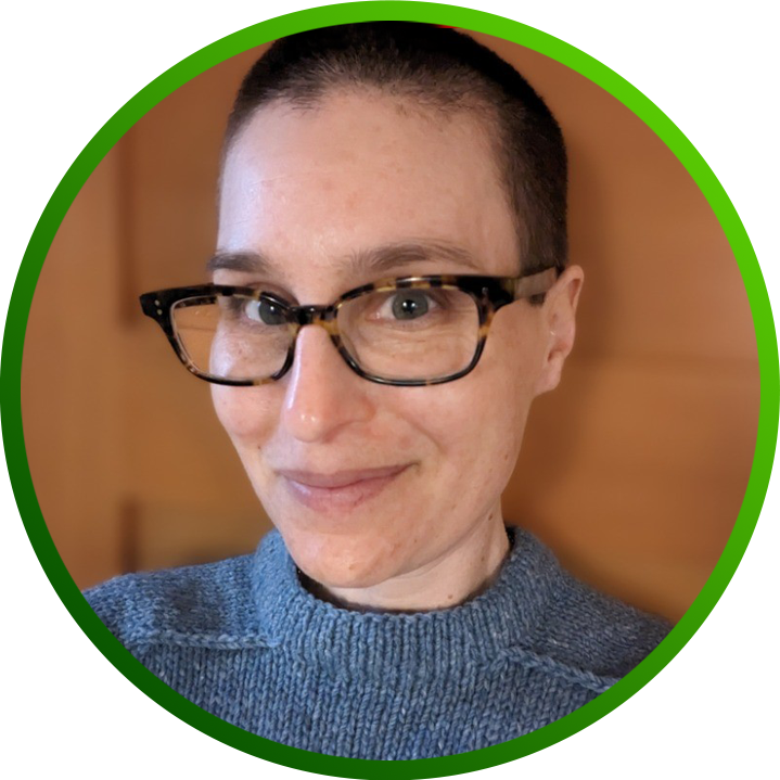 Portrait photo of Lea Kissner, CISO of LinkedIn, wearing a grey-blue sweater and glasses.