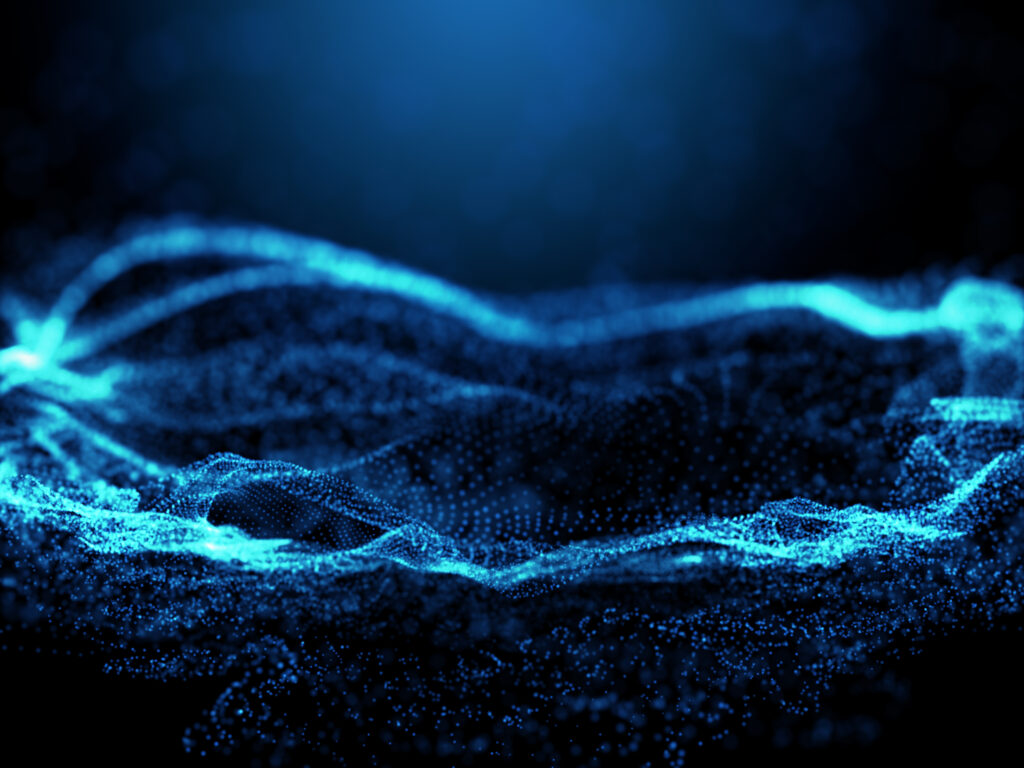 Abstract 3D visualization of glowing cyan particle waves on a dark background, representing continuous data flow and real-time cybersecurity threat monitoring.