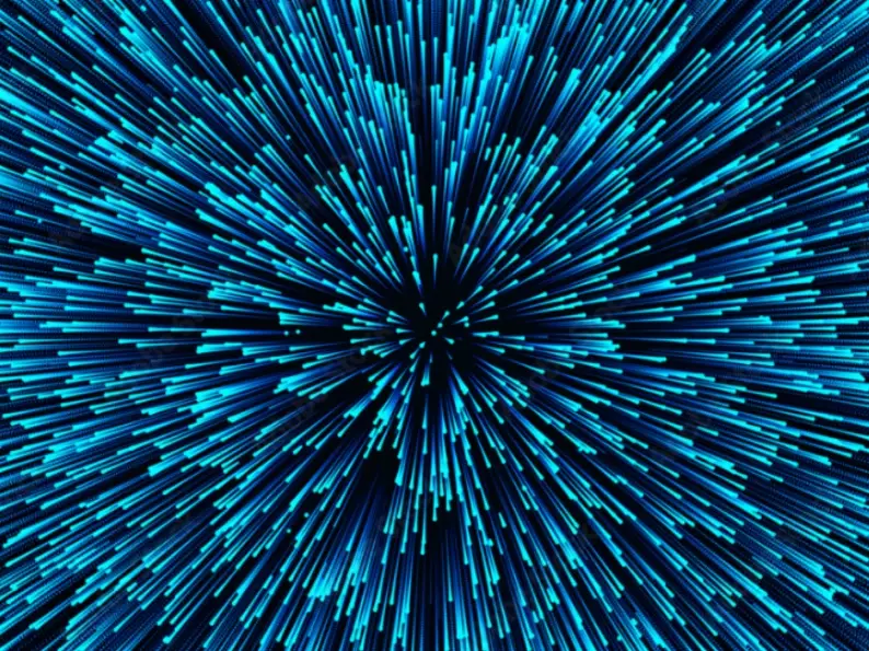 Abstract blue light burst radiating outward from a central point, resembling warp speed.