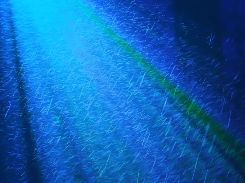 Abstract blue diagonal streaks resembling falling light particles or rain.